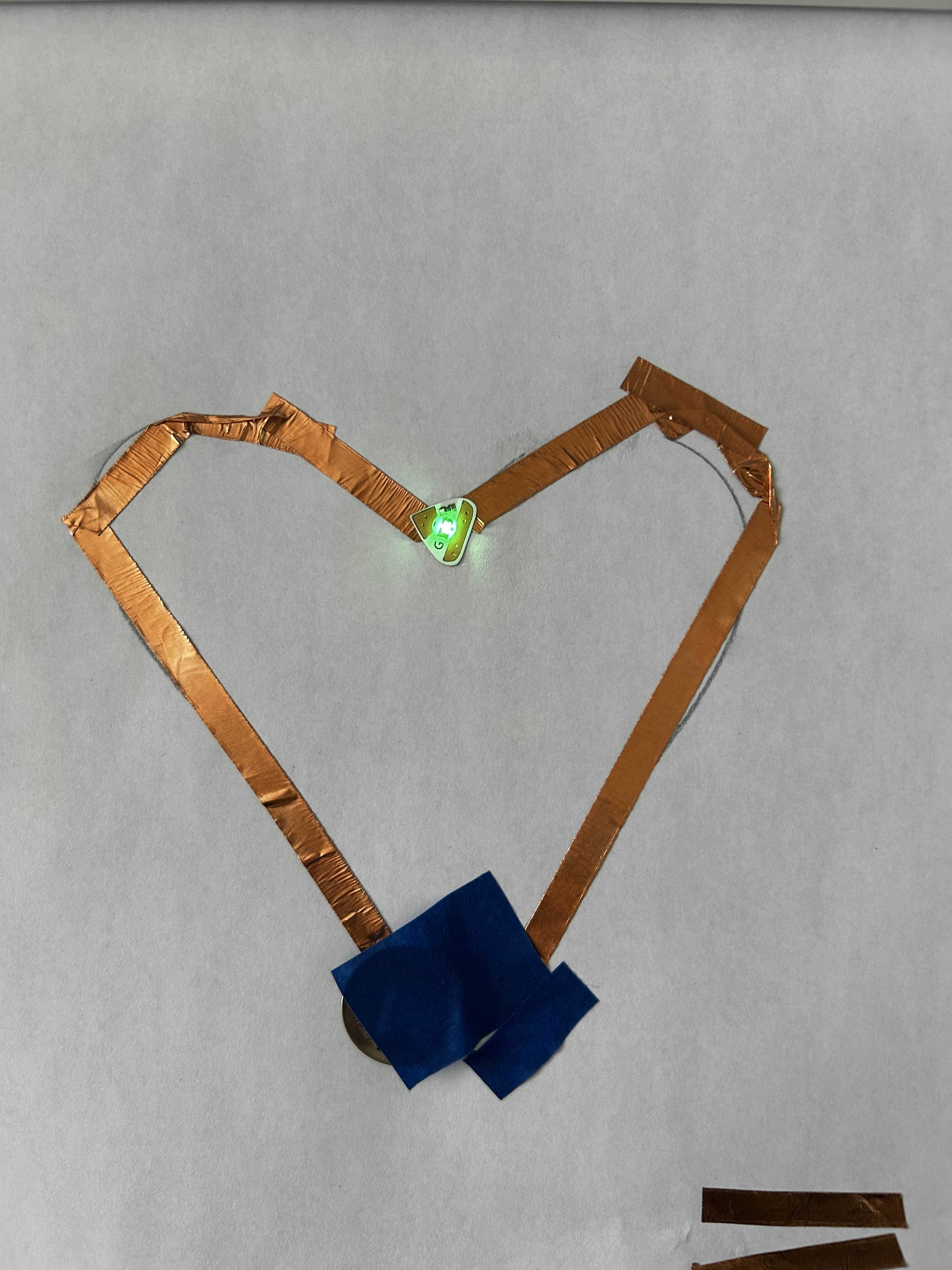 tried to turn the tape into a heart, testing the boundaries of how much i can curve it